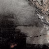 Rugged mixed media drawing of a head (signature)