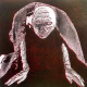 Crawling Woman 1 Black/Red A woman crawls along the ground. She is bald, skeletal and covered in a removal blanket. Printed and tinted/shaded in black and red.