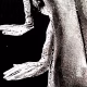 Detail: A woman crawls along the ground. She is bald, skeletal and covered in a removal blanket. Printed and tinted/shaded in black.