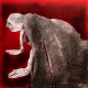 A woman crawls along the ground. She is bald, skeletal and covered in a removal blanket. Printed and tinted/shaded in red.