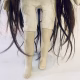 Uncanny girl doll with long dark brown hair. Legs and hips view.