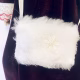 Doll detail: fluffy, furry white handbag.