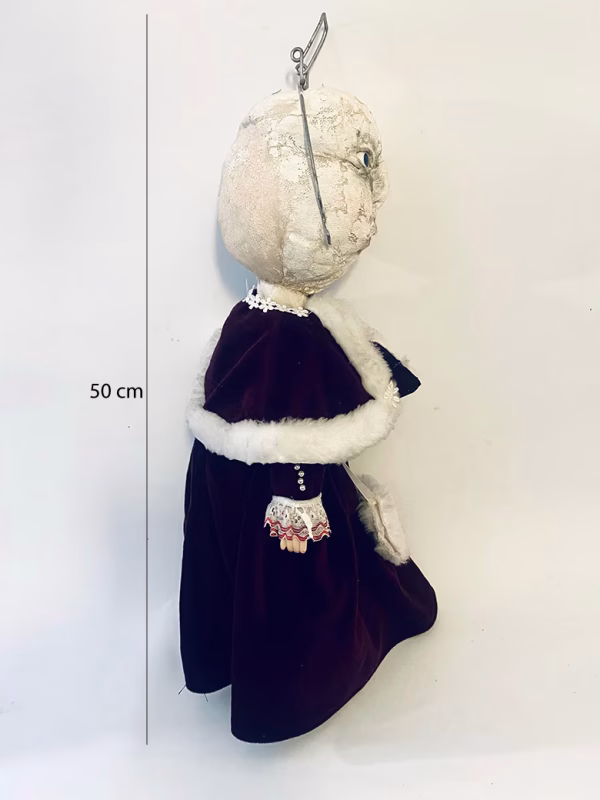 Hacked doll with a Kilner jar clip around its 'ugly' uncanny head.