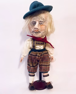 Hacked doll with soft body and china hands and feet. Doll face is replaced with uncanny head made from textile.