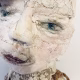 Hacked doll with decayed silk dress. The original ‘pretty’ head is replaced with an oversized, bald, uncanny head.