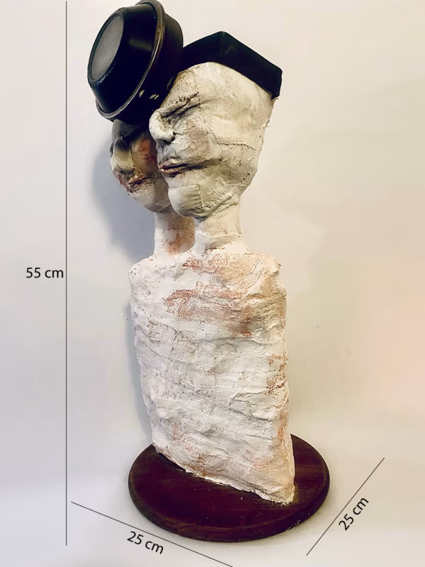 Double headed skeletal torso sculpture crowned with a vintage mechanical hubodometer