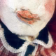 Uncanny girl doll with checkered dress (face close-up).